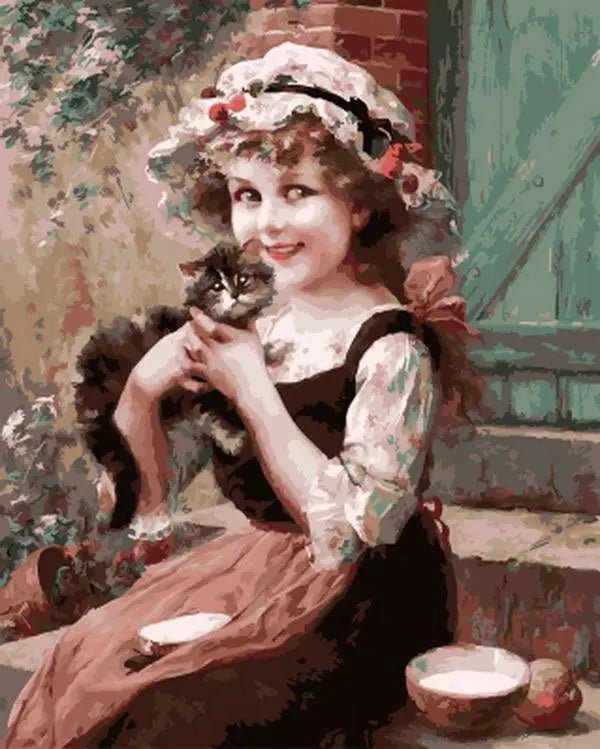 A Little Girl With A Kitten