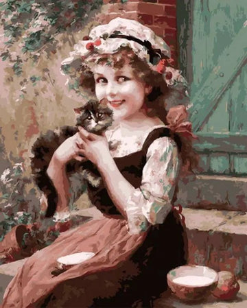A Little Girl With A Kitten