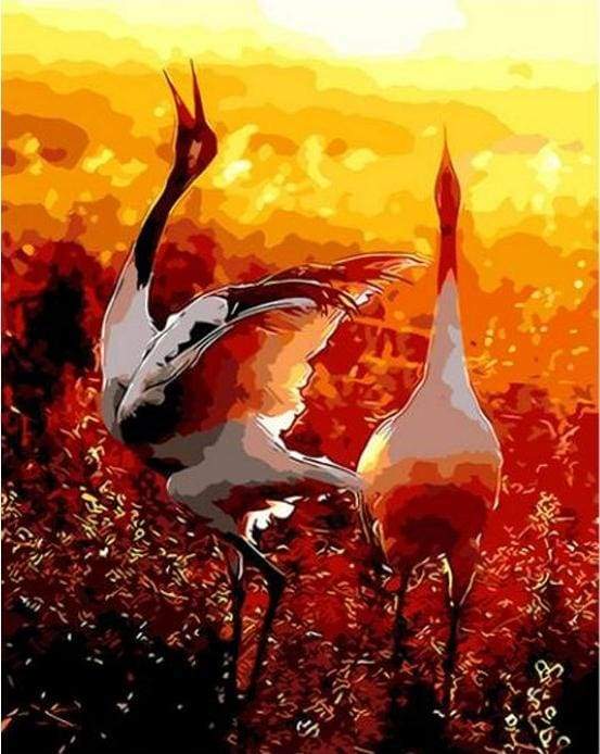 Two cranes in the Sun